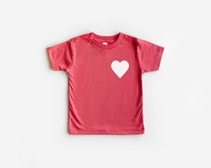 Valentines Day Heart Shirt, Love Shirt, Matching Shirts, Mommy And Me Shirts, Happy Valentines Day, Valentines Day Gift, Kids Shirts, Heart CARE * Please wash inside out, in cold water * Tumble dry low or hang dry if desired * No fabric softeners and a Mild Detergent * Do not iron over graphic DETAILS * All items are handmade from professional and high quality materials. * Each piece is created with great attention to detail. Orders are made-to-order and will be shipped out in 3-5 business days Playful White Heart Print Tops, Valentine's Day Cotton Shirt As Gift, Cotton Top With Heart Graphic For Valentine's Day, Heart-shaped Pink Top For Valentine's Day, Cotton Shirt For Valentine's Day Gift, Playful Short Sleeve Tops With Heart Print, Cotton Top As Valentine's Day Gift, Cotton Shirt As A Valentine's Day Gift, Playful Cotton Tops With Heart Print