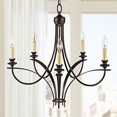 a chandelier with five candles hanging from it