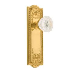 an image of a golden door handle with a white flower on it's side