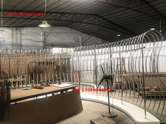 the inside of a building with metal fencing