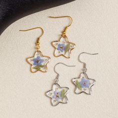 Five-pointed Star Earrings | Forget Me Not Flower Earrings | Resin Earrings | Handmade Real Pressed Flower Earrings | Christmas Gift for Her 🌸The Five-pointed Star Earrings, Forget Me Not Flower Earrings are a stunning and unique accessory that adds a touch of elegance to any outfit. Handmade with real pressed flowers encased in resin, these earrings showcase the beauty and delicacy of nature. The five-pointed star design adds a touch of whimsy and charm, while the forget-me-not flowers symbolize love and remembrance. These earrings are perfect for those who appreciate handmade craftsmanship and want to make a statement with their jewelry. Whether it's for a special occasion or daily wear, these earrings are sure to catch the eye and spark conversation.  H I G H L I G H T  - Handmade: Eac Pressed Flower Earrings, Forget Me Not Flower, Earrings Resin, Five Pointed Star, Earrings Christmas, Five Points, Christmas Gift For Her, Star Design, Resin Earrings