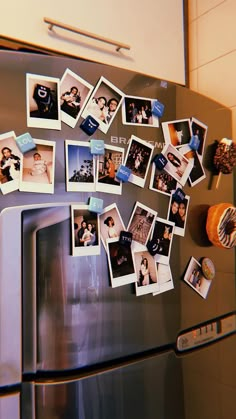 the magnets on the refrigerator are filled with photos