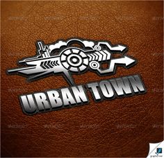 the urban town logo is shown on a brown leather surface with silver letters and arrows