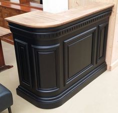 a kitchen island with a wooden counter top