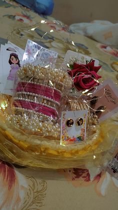 there is a cake with pearls and cards on it