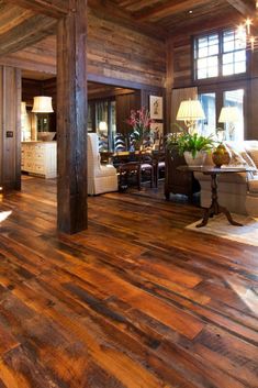 a living room filled with furniture and wooden floors