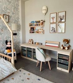 a child's bedroom with a bed, desk and toy animals on the wall