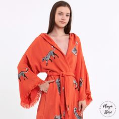 You may use Playa's kimonos for lots of areas of life such as luxury bathrobes, bohemian bathrobes, hijab dresses, organic housecoats, beach cover-ups, kimono jackets, ethnic kaftans, cardigans, women's robes, and bridal gifts. Playa kimono's are always with you when you want to be timeless but don't compromise on style; At the beach on a sunny day On a fun festival day On a day when you hang out with your friends During a shiny breakfast morning While enjoying a bath&beauty or during your medit Orange Long Sleeve Kaftan For The Beach, Red Kimono For The Beach, Traditional Long Robe For The Beach, Oversized Traditional Kimono For Beach, Traditional Summer Beach Robe, Red Beach Robe, Bohemian Orange Wrap Kimono, Red Beach Robe For Spring, Traditional Wrap Robe For Beach