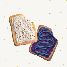 two pieces of bread with icing and sprinkles on them sitting next to each other