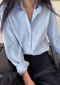 Color: Blue Stripe Woven shirting fabric Regular fit Rounded collar Curved hem Button cuffs Button front closure 96% Polyester 4% PU Dry Clean By The Frankie Shop. Imported Product Measurements: S- 17" Shoulder, 40" Bust, 27.5" Length M- 17.5" Shoulder, 42" Bust, 28" Length L- 18" Shoulder, 44" Bust, 28.5" Length XL- 18.5" Shoulder, 46" Bust, 29" Length Model is 174cm/ 5'8" wearing size S Stripped Shirts For Women, Blue Button Shirt Outfit, Blue Stripped Shirt Outfit Women Work, Shirts Button Up, Outfits With Blue Button Up Shirt, Outfit With Striped Shirt, Striped Shirts For Women, Over Sized Shirts Outfit For Women, Blue Stripped Shirt Outfit Women