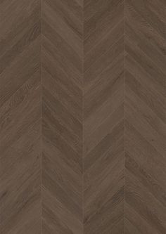 an image of wood flooring that looks like chevroned herringbones in dark brown