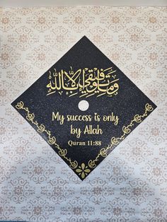 a black and gold graduation cap with the words my success is only by aloh written on it