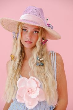 Get ready to turn heads with THE PENELOPE SUN HAT! This lavender beauty features gold accents, a pretty pink ribbon band, delicate white feathers, and a colorful flower combo. Protect your skin in style and add a touch of whimsy to any outfit. This hat is ONE OF A KIND, created by our owner Stephanie. To receive item quicker, expedited shipping is available at checkout. Whimsical Spring Vacation Hats, Pink Summer Hat For Garden Party, Whimsical Pink Summer Hat, Whimsical Pink Hat For Garden Party, Pink Summer Party Hat, Whimsical Spring Hats For Garden Party, Whimsical Spring Hats, Pink Mini Hat For Beach Spring Season, Feminine Summer Hats For Garden Party