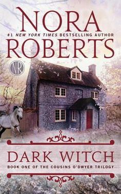 the cover of dark witch by nora roberts, with an image of a horse in front of a house