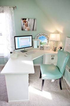 a white desk with a computer on top of it