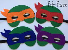 four masks with different colors on them are shown in the shape of tmnt's