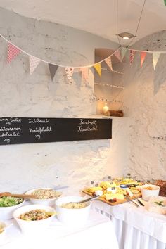 a table filled with lots of food and bunting