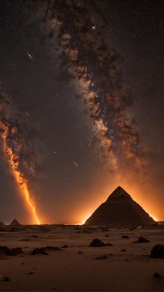 the night sky is filled with stars and clouds, as well as an image of two pyramids