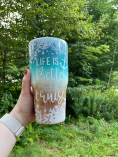 a person holding up a coffee cup with the words life is better on the inside