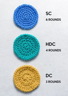 three crochet coasters are shown in different colors