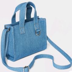 Add A Charm, Pom Pom, Or Key Chain To This Cute Little Denim Bag, To Make It Even More Cute. This Will Go Great With Matching Jeans Pants, Or Denim Top, Jeans Jacket Etc. It Will Also Stand Out In Any Casual Outfit. Has An Adjustable Crossbody Strap, And 2 Top Handle. Zipper Closure. An Attached Key Chain Ring For Charms, Keys Etc.. On-the-go Denim Bag With Zipper Closure, Denim Bags With Zipper Closure, Denim Crossbody Shoulder Bag For Shopping, Spring Denim Blue Shoulder Bag With Adjustable Strap, Denim Crossbody Shopping Bag, Denim Crossbody Bag For Shopping, Denim Shoulder Bag With Adjustable Strap For Shopping, Denim Shopping Bag With Adjustable Strap, Spring Denim Rectangular Bag