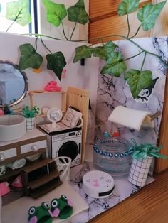 there is a doll house with plants and decorations