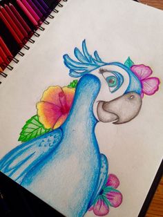 a drawing of a blue bird with flowers in its beak