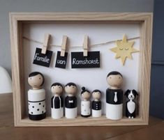 a family photo frame with clothes pins and pegs