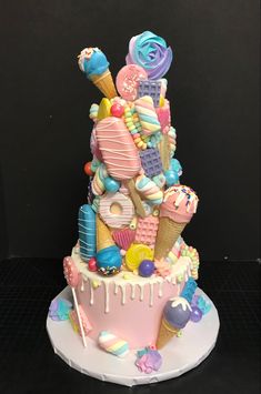 a cake that is made to look like it has ice cream and candy on top