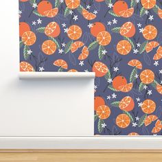 an orange wallpaper pattern with flowers and leaves on a blue background, next to a white door