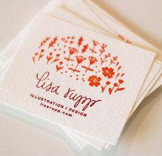 four red and white business cards sitting on top of each other