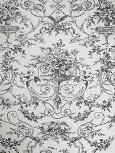 an ornate wallpaper with black and white designs