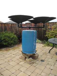 a blue cooler sitting on top of a brick patio