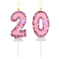 the number twenty two candles are decorated with pink sequins