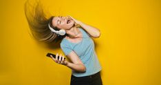 a young woman listening to music with headphones