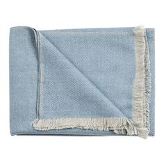 a blue blanket with fringes on it