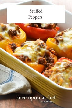 stuffed peppers in a casserole dish on a wooden table with the title above it