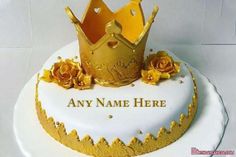 there is a cake with a crown on top and flowers around the edges that says any name here