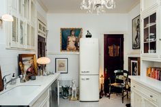 a white refrigerator freezer sitting inside of a kitchen