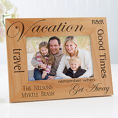 a wooden frame with an image of two people and a child