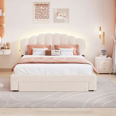 a white bed sitting in a bedroom on top of a hard wood floor