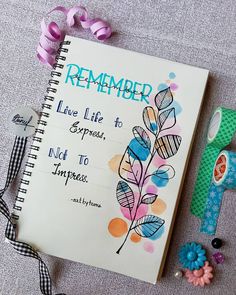 a notepad with the words, remember live life to express, and flowers next to it