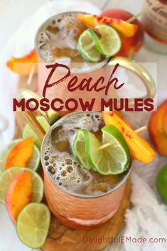 two glasses filled with peach moscow mules on top of a cutting board