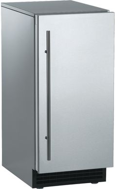 a silver refrigerator freezer sitting on top of a white floor next to a wall