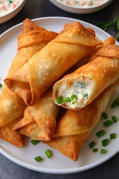 some food is on a white plate and ready to be eaten by the person in the photo