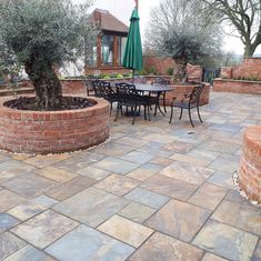 an outdoor patio with tables and chairs