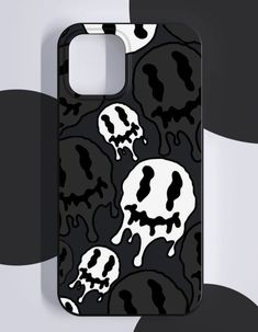 a black and white phone case with skulls on it