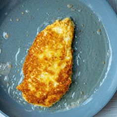 an omelet is being cooked in a frying pan