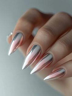 Combine futuristic shine with a classic gradient in this stunning chrome ombre nail design. Featuring a sleek metallic finish that transitions from silver to pastel pink, this look is perfect for any occasion where you want to stand out.    **Steps to Create the Look:**   1. Apply a clear or nude base coat for a smooth foundation.   2. Use a chrome powder to create a metallic effect, starting at the base and fading toward the tips.   3. Blend the chrome into pastel pink polish for a seamless ombre transition.   4. Seal the design with a glossy topcoat to enhance the metallic shine.    **Tagged Topics:**   #ChromeOmbreNails, #MetallicManicure, #FuturisticNailArt, #ElegantGradient Ombre Chrome Nails Almond, French Ombre Chrome Nails, Chrome Tipped Nails, Chrome Ombre Nails Designs, Metallic Ombre Nails, Chrome Ombré Nails, Ombre Chrome Nails Designs, Ombré Chrome Nails, Chrome Ombre Nails