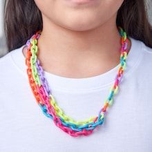 a woman wearing a multicolored necklace